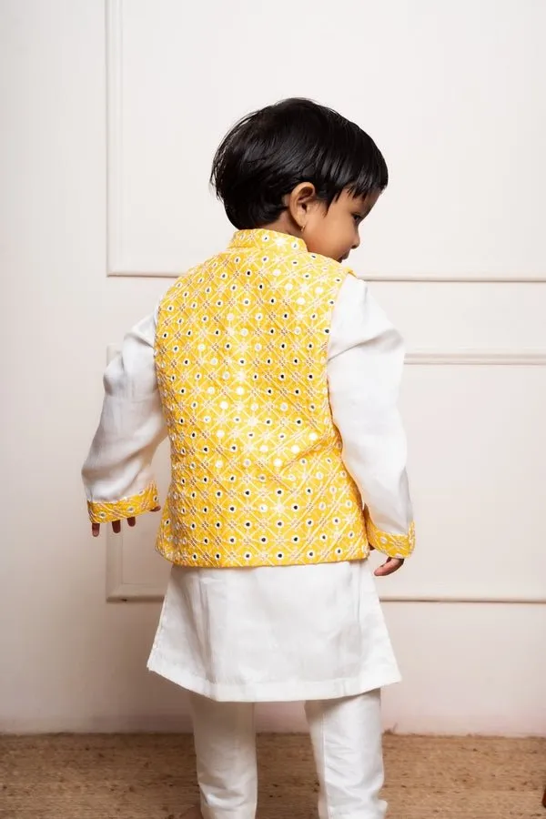 Elegant white kurta set with a vibrant yellow mirror-work Nehru jacket for a festive and stylish look