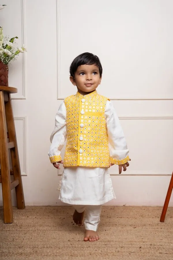 Elegant white kurta set with a vibrant yellow mirror-work Nehru jacket for a festive and stylish look