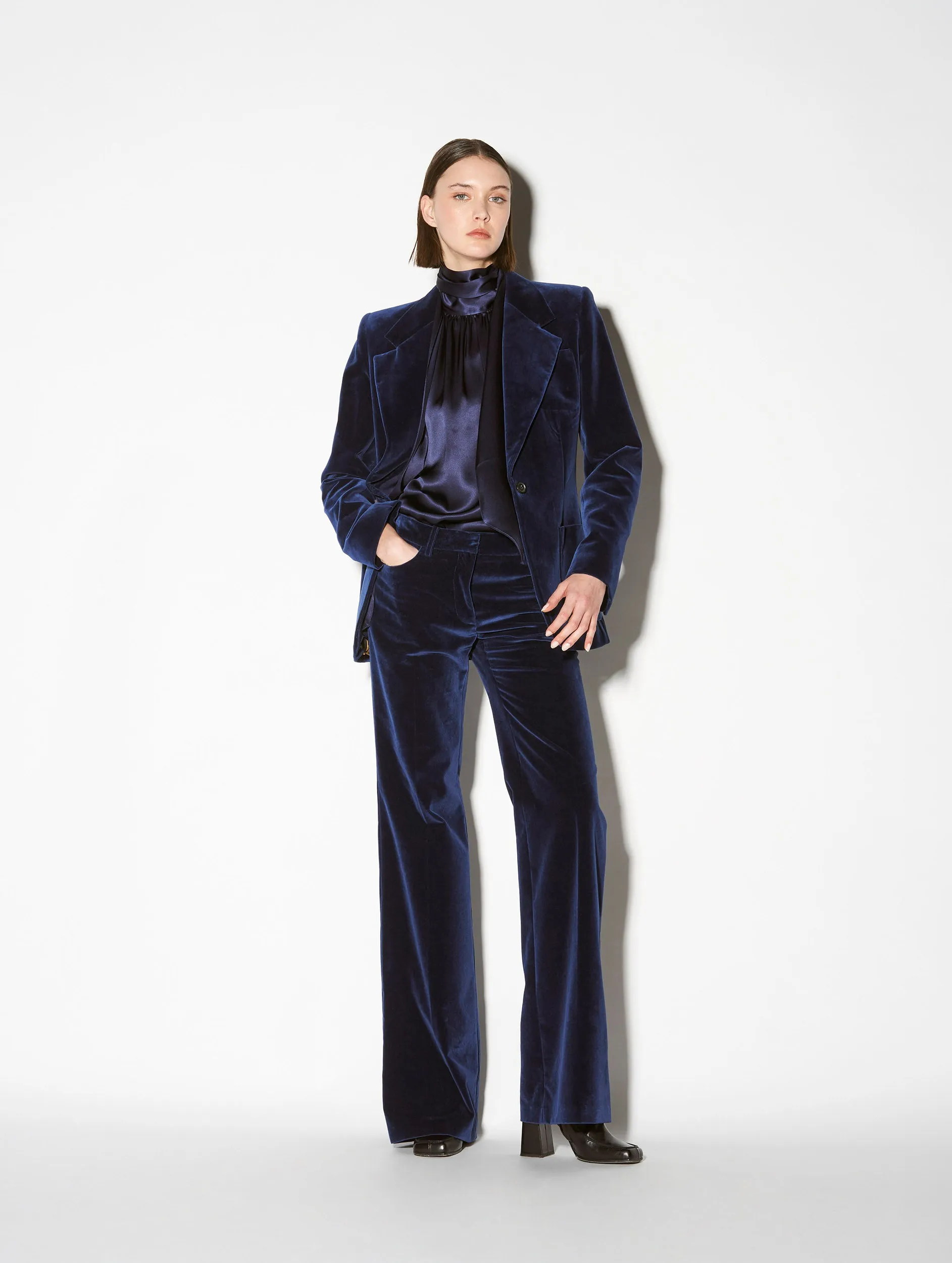 Flared blue velvet trousers