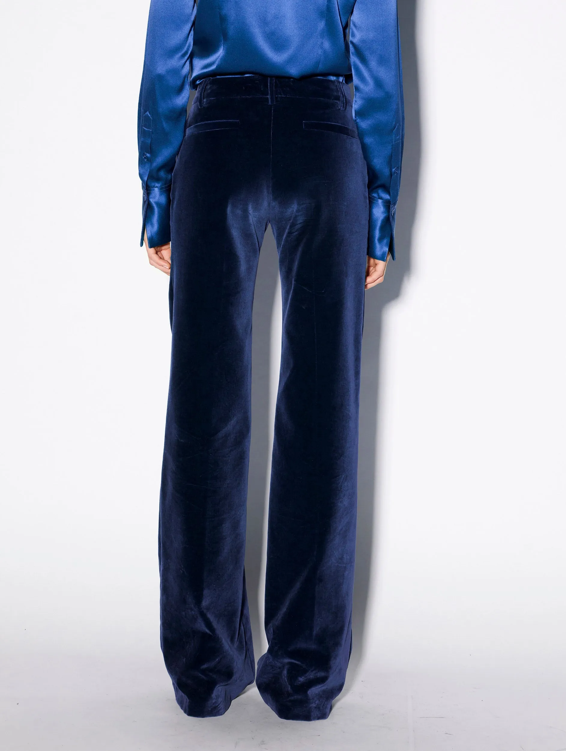 Flared blue velvet trousers